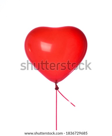 Red heart latex balloon single object for birthday party isolated on white background
