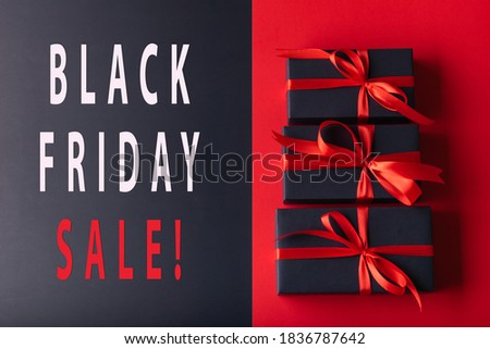 3 black box with red ribbon on half red color background and half black color background. 11.11 single day, Monday, Friday sale concept