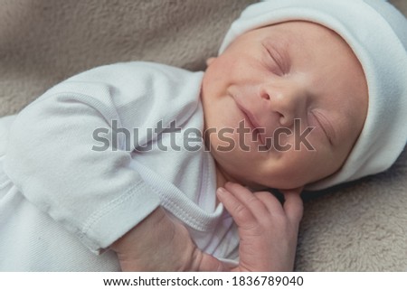 cute newborn baby sleeping peacefully on the blanket. High quality photo