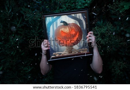 Spooky man turning into a skeleton behind a picture frame