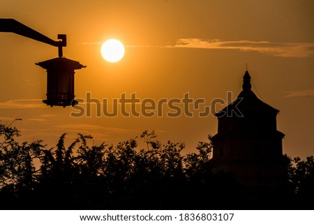 XI'AN, CHINA - AUGUST 5, 2018: Sunset behind the Big Wild Goose Pagoda in Xi'an, China