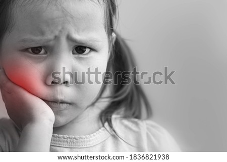 Cavity. A little girl with severe pain in her teeth and gums. Dental care. Royalty-Free Stock Photo #1836821938