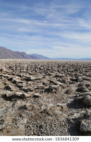 A vertical picture of Devil's Golf Course in Death Valley National Park in California