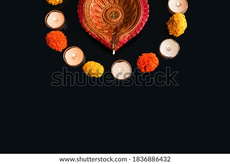 Indian festival diwali , Colorful lamps of oil on dark background