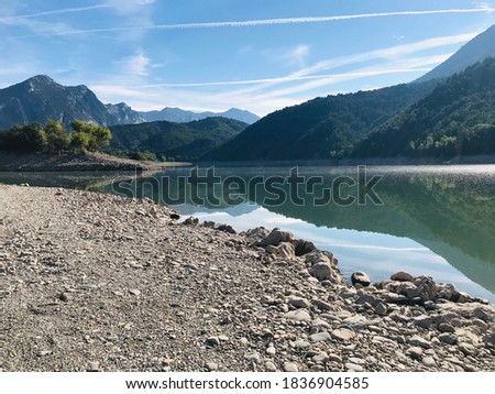 mountain reflecting in the calm water on the lake
