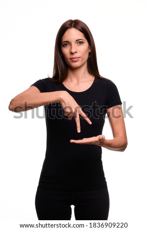 Isolated in white background brunette woman saying dance in spanish sign language