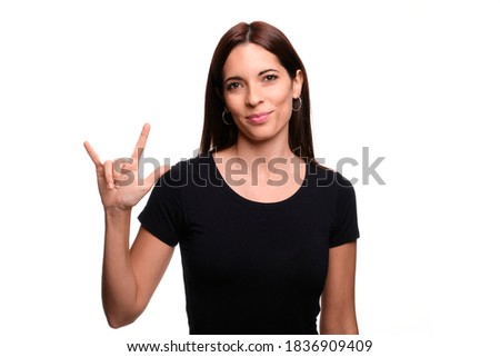 Isolated in white background brunette woman saying  I love you in spanish sign language