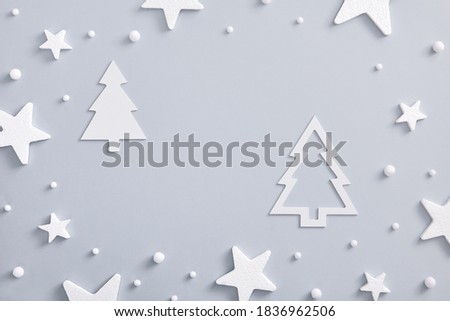Christmas minimal concept - monochrome layout with white star and snowball. Horizontal composition, flat lay, top view. White fir tree silhouette. Holiday mockup. Vintage mock up for decoration design