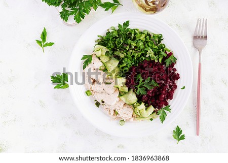 Trendy salad. Chicken boiled fillet with salad beetroot and cucumber. Healthy food, ketogenic diet, diet lunch concept. Keto/Paleo diet menu. Top view, overhead