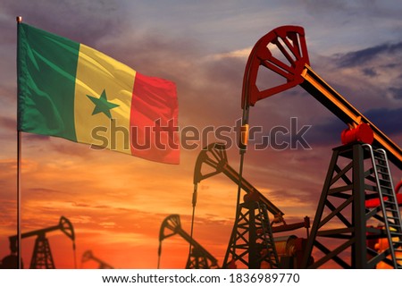Senegal oil industry concept, industrial illustration. Senegal flag and oil wells and the red and blue sunset or sunrise sky background - 3D illustration