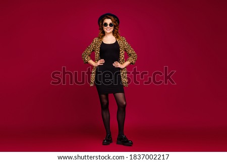 Full length body size view of nice-looking attractive fashionable pretty lovely classy cheerful cheery wavy-haired model posing hands on hips isolated over red maroon burgundy marsala color background