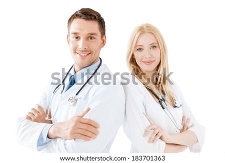 healthcare and medical concept - smiling young male doctor and female nurse with stethoscope in hospital