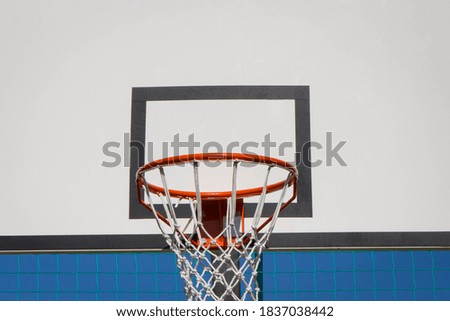 Basketball board with hoop on sky background. Sport and recreation time
