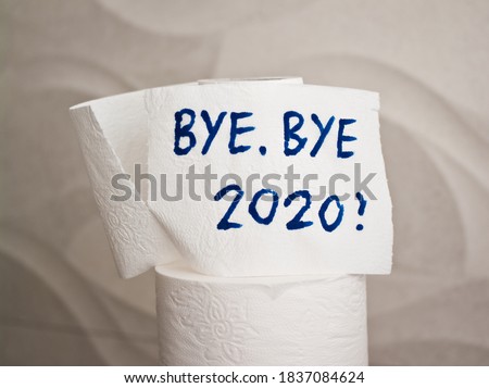 Conceptual image of toilet paper, symbol of covid-19 crisis and pandemia in 2020. Abstract image, saying goodbye to the bad year, leaving the past behind, hoping for better. Royalty-Free Stock Photo #1837084624