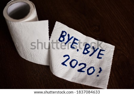 Conceptual image of toilet paper, symbol of covid-19 crisis and pandemia in 2020. Abstract image, saying goodbye to the bad year, leaving the past behind, hoping for better. Royalty-Free Stock Photo #1837084633