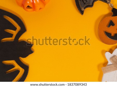 Halloween decorations on yellow background. Halloween concept. Flat lay, top view