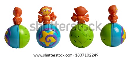 monkey on ball plastic toy for baby on isolated white background