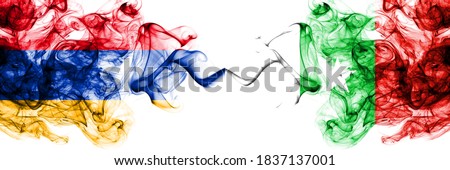 Armenia vs Casamance, Senegal  smoky mystic flags placed side by side. Thick colored silky abstract smoke flags