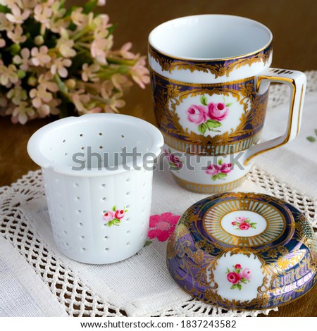 a stock photo of a mug of tea or coffee with antique pattern