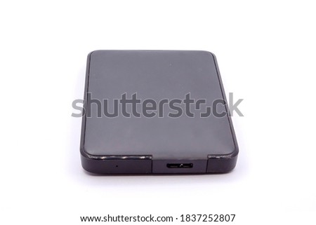 HDD - Grey Portable External Hard Disk Drive isolated on white background. External hard disk drives.
