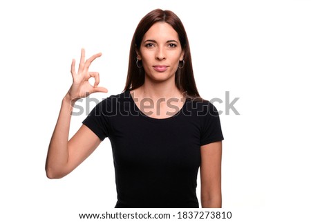 Isolated in white background brunette woman saying letter S in spanish sign language