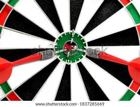 Close-up of a dart board with an imprinted flag of Jordan in the center. The concept of achieving goals.