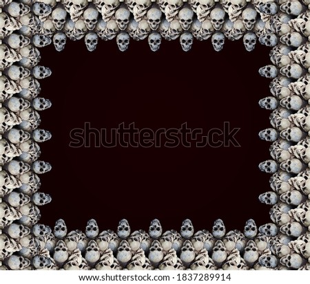 Skull frame pattern with empty space for your design. Skills isolated on dark background.