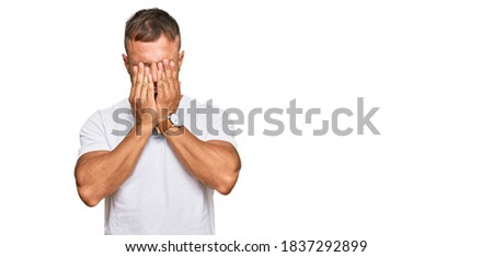 Handsome muscle man wearing casual white tshirt rubbing eyes for fatigue and headache, sleepy and tired expression. vision problem 