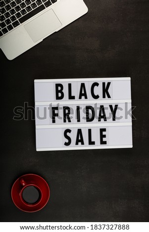 Creative promotion composition for Black friday with laptop on black background. Flat lay, top view, overhead, mockup, template. Minimal abstract background. Online shopping, sale, promo. Web banner