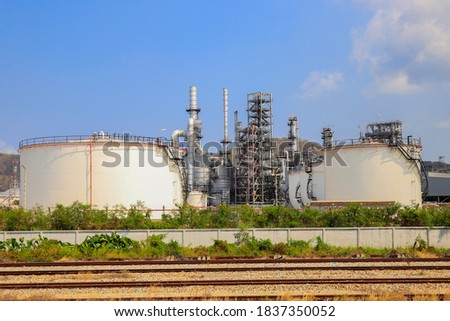 oil refinery at blue twiligth sky background