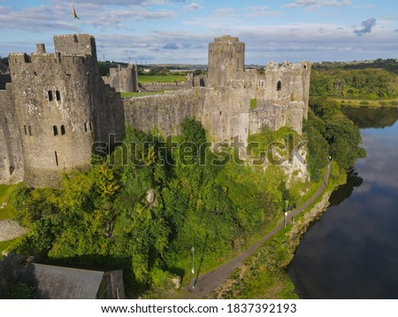 Side View of Pembroke Castle in Pembrokeshire, Wales, UK. This medieval fortress is nearly 1000 years old and the birthplace of Henry VII and the Tudor dynasty. 
