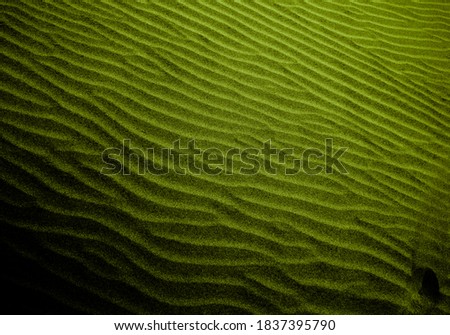 Salad colored shaded sands of the desert. Background and texture for modern design