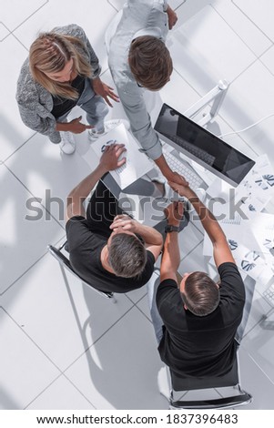 businessmen in a modern office sign a contract