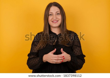 Business Concept - Portrait Handsome Business woman holding hands with confident face isolated over gray Background.