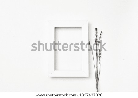 White frame on a white background and lavender. Copy space flat lay, top view