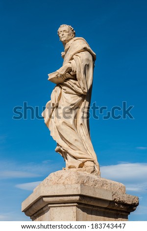 Statue on the Trinity bridge in Valencia, Spain