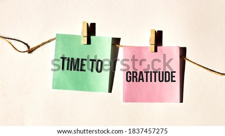 code of conduct text words TIME TO GRATITUDE on yellow sticker note on white wall or table.