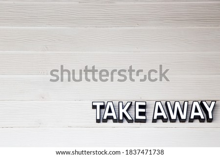 Take awasy singnature on wooden textured wall. Pandemic concept. Royalty-Free Stock Photo #1837471738
