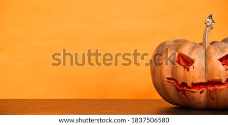 halloween pumpkins on orange background copy space