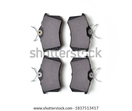 brake pads for disc brakes on a white background. car repair concept, brake replacement, car maintenance. copy space. flat lay.