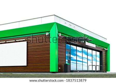 New building of a small cafe in green and brown colors. With large storefronts and a Billboard