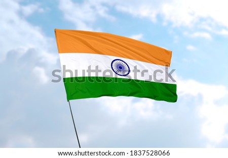 Flag of India in front of blue sky
