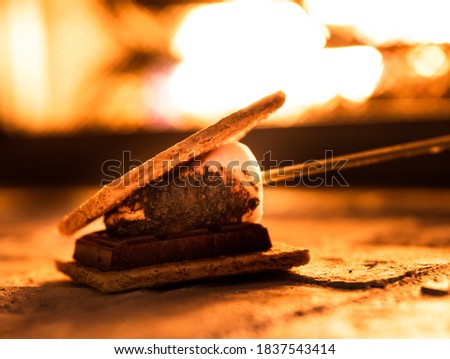 Some delicious s'mores next to the fire