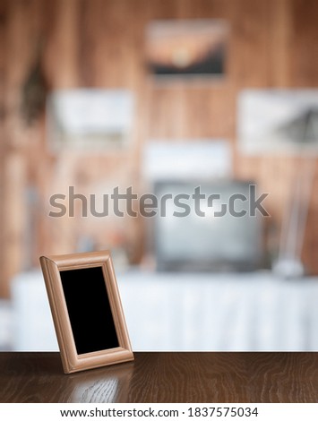 old photo frame on the wooden table in the living room