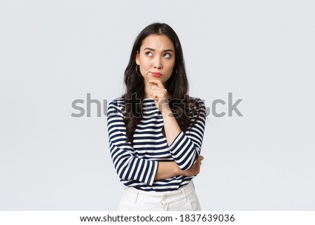 Lifestyle, people emotions and casual concept. Thoughtful troubled businesswoman thinking. Girl searching solution looking up pondering, making difficult choice Royalty-Free Stock Photo #1837639036
