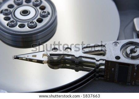 A close up macro of an opened computer harddrive.