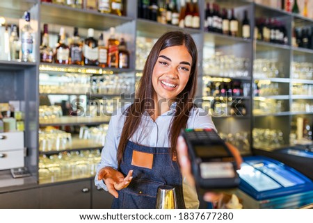 Contactless payment concept, female holding terminal nfc technology on counter, client make transaction pay bill on terminal rfid cashier machine in restaurant store, close up view