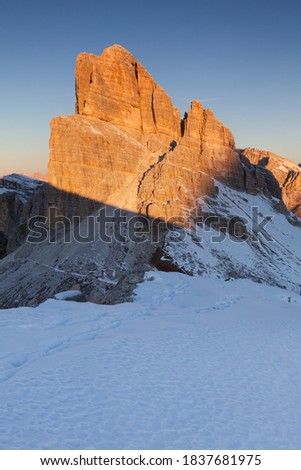 Seasonal autumnal scenery in highlands. Alpine landscape in Dolomite mountains, Southern Tyrol area, Italy. Popular travel destination in autumn. First snow.