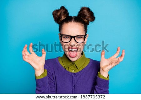 Close-up portrait of her she nice attractive angry mad fury schoolgirl scaring attacking you scandal isolated on bright vivid shine vibrant blue green teal turquoise color background
