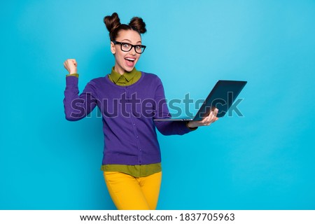 Photo of attractive lady two pretty buns hold notebook distance studying diligent student read teacher email good marks grades wear specs casual outfit isolated blue color background